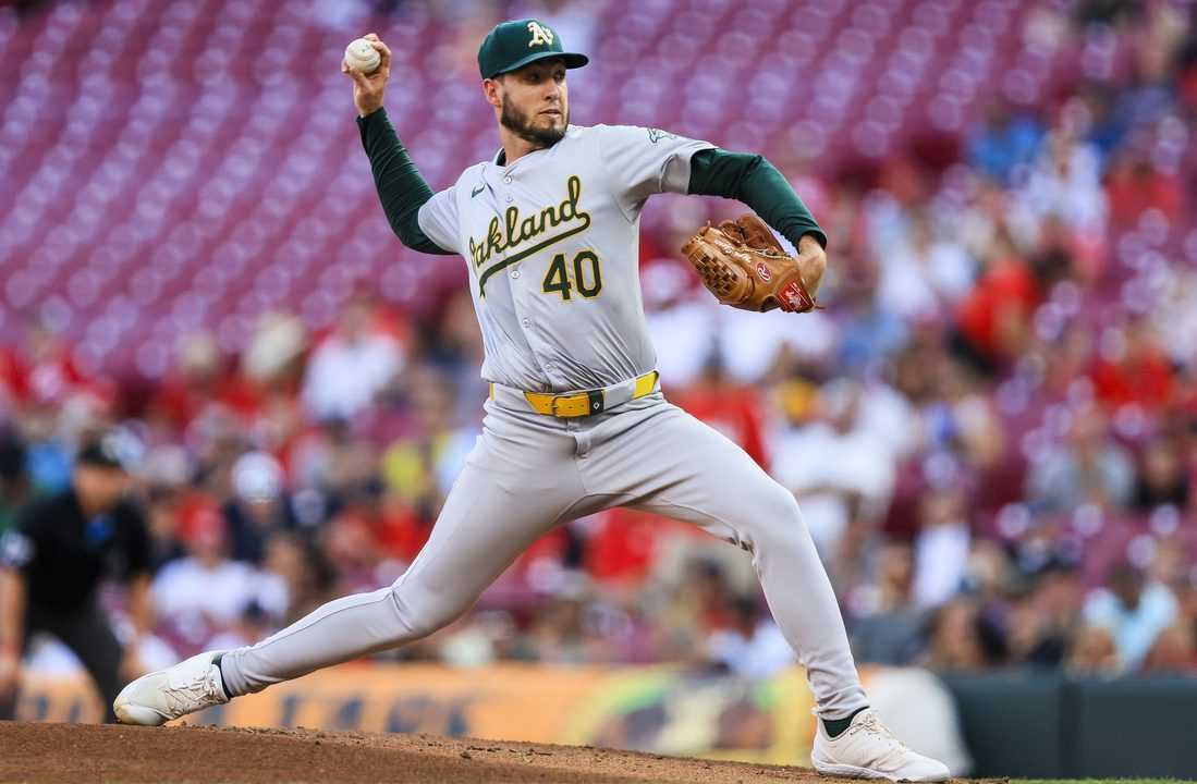 A’s go deep twice in 7th, narrowly fend off Reds